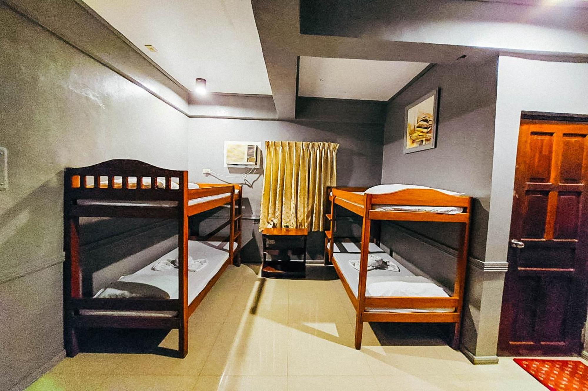 Mbg Travellers Inn Powered By Cocotel Puerto Princesa Camera foto