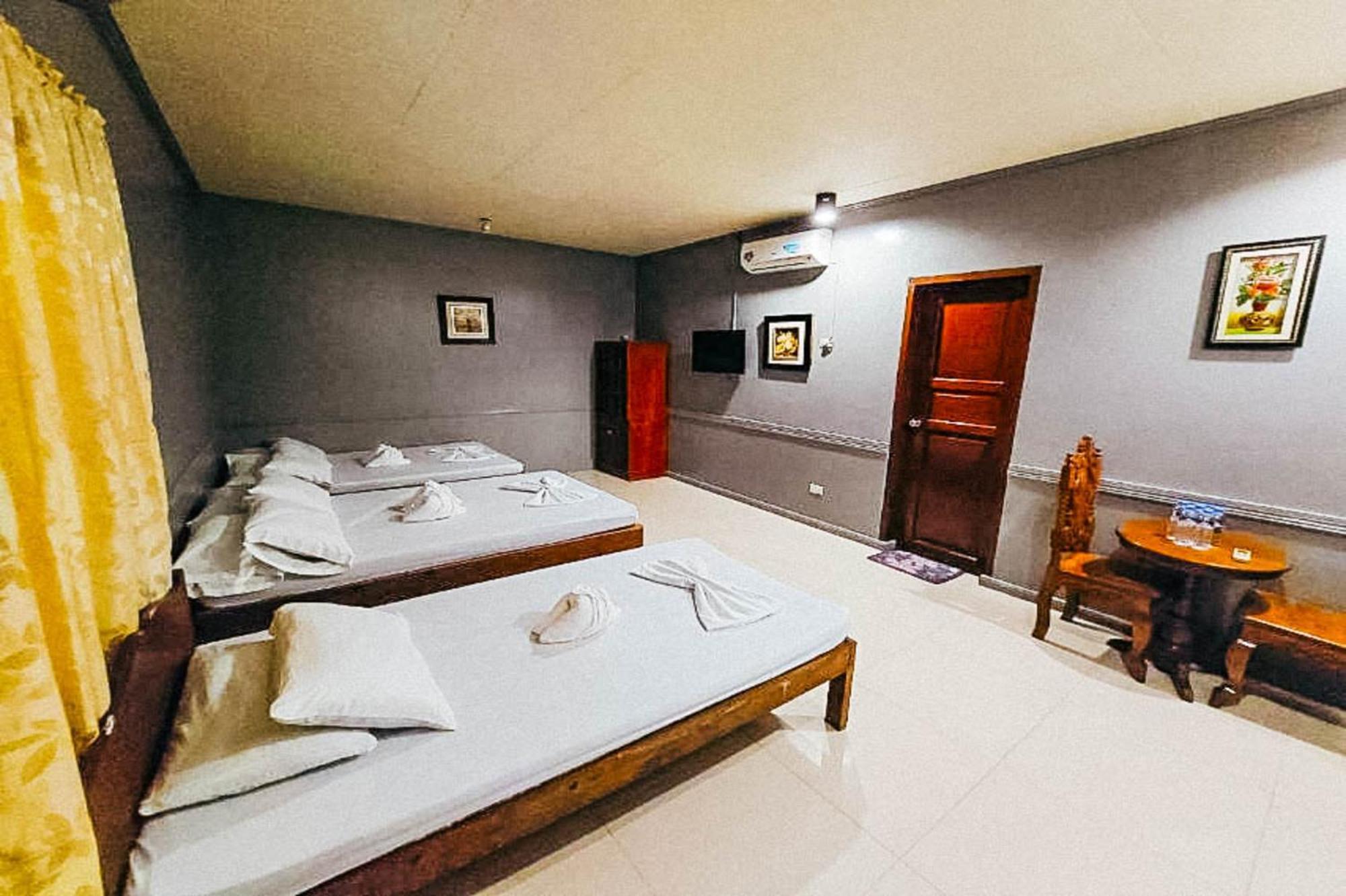 Mbg Travellers Inn Powered By Cocotel Puerto Princesa Camera foto