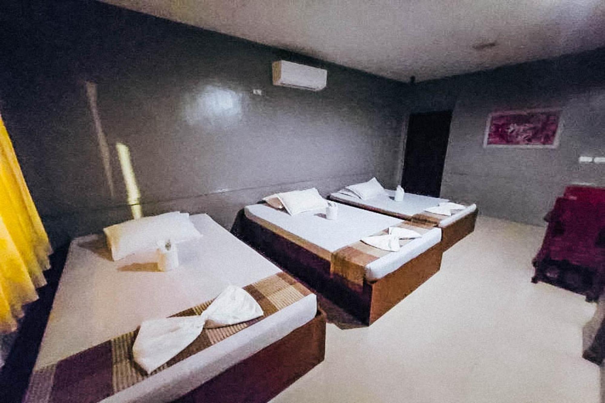 Mbg Travellers Inn Powered By Cocotel Puerto Princesa Camera foto