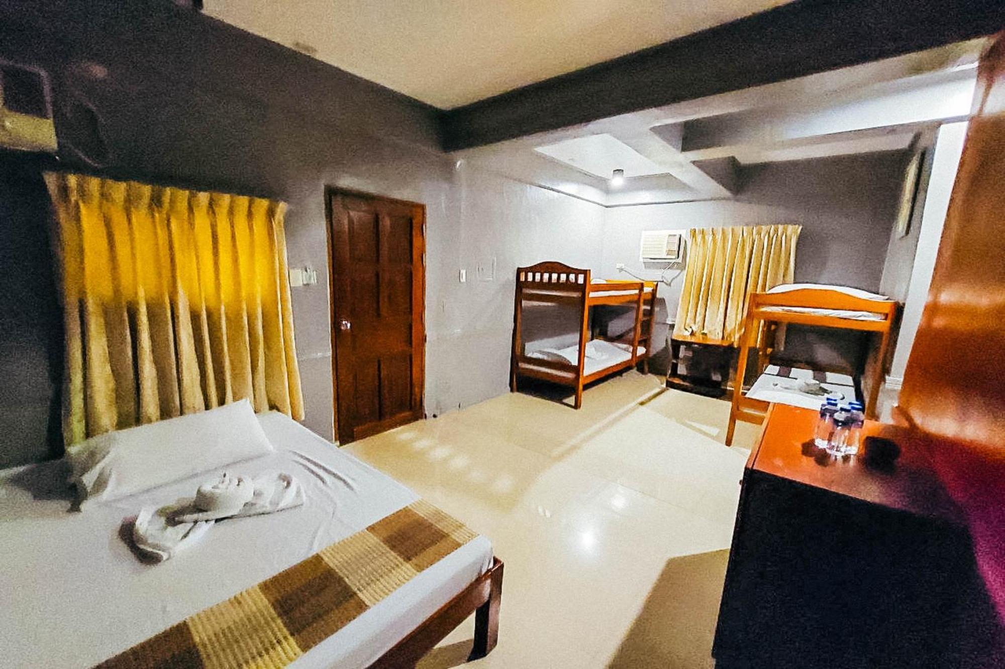 Mbg Travellers Inn Powered By Cocotel Puerto Princesa Camera foto