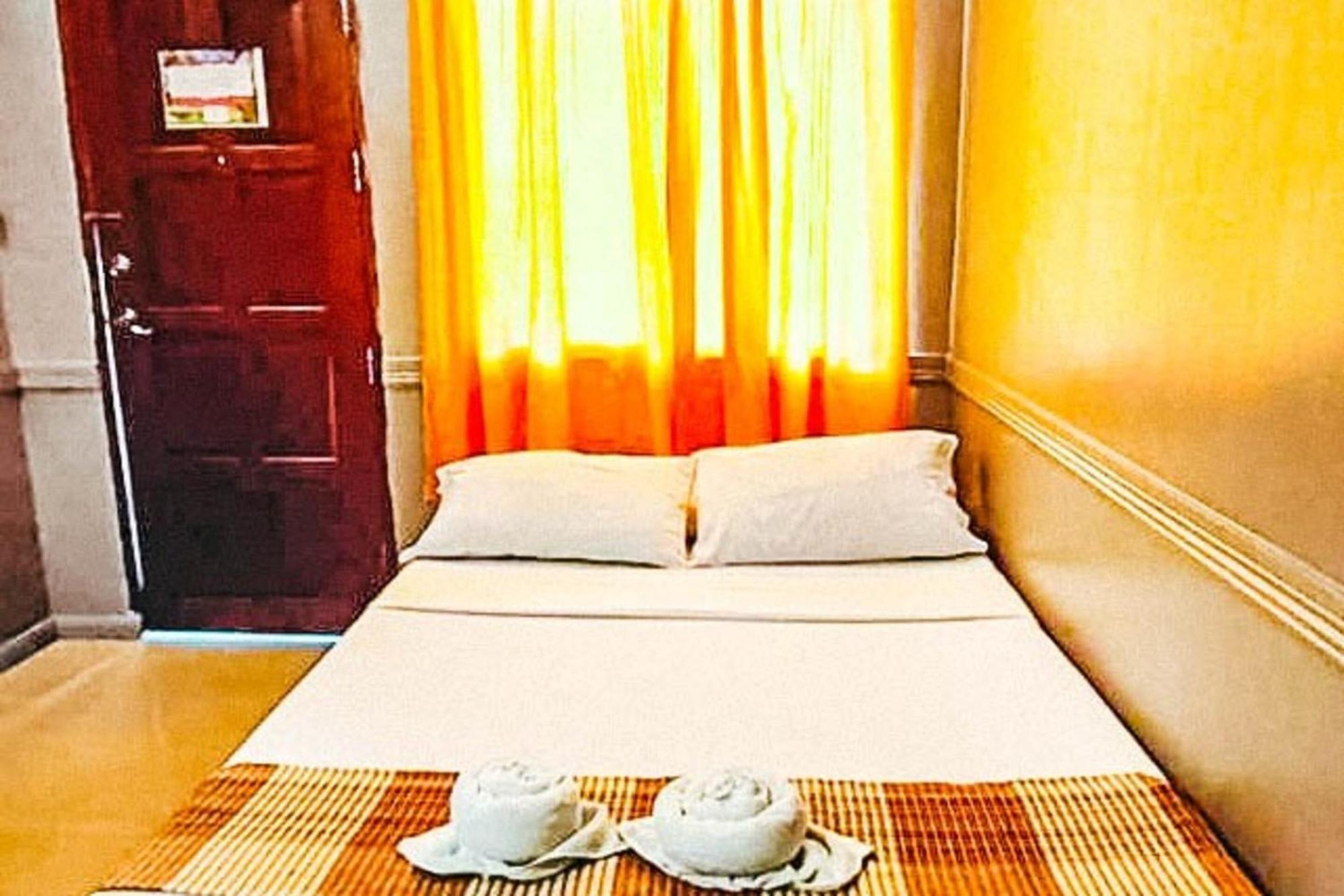 Mbg Travellers Inn Powered By Cocotel Puerto Princesa Camera foto
