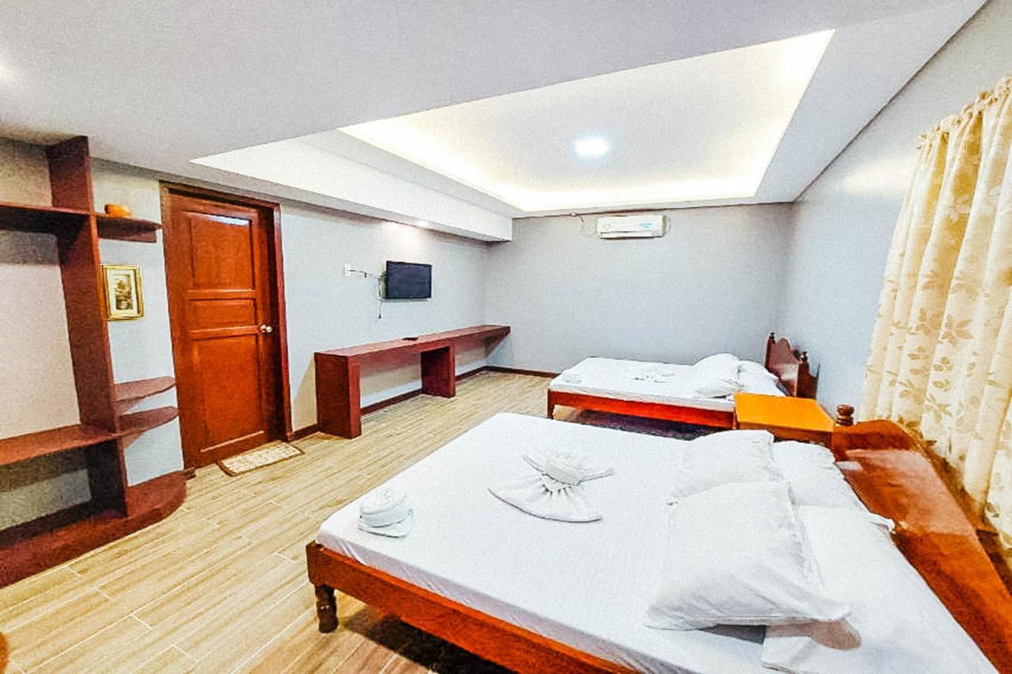 Mbg Travellers Inn Powered By Cocotel Puerto Princesa Camera foto