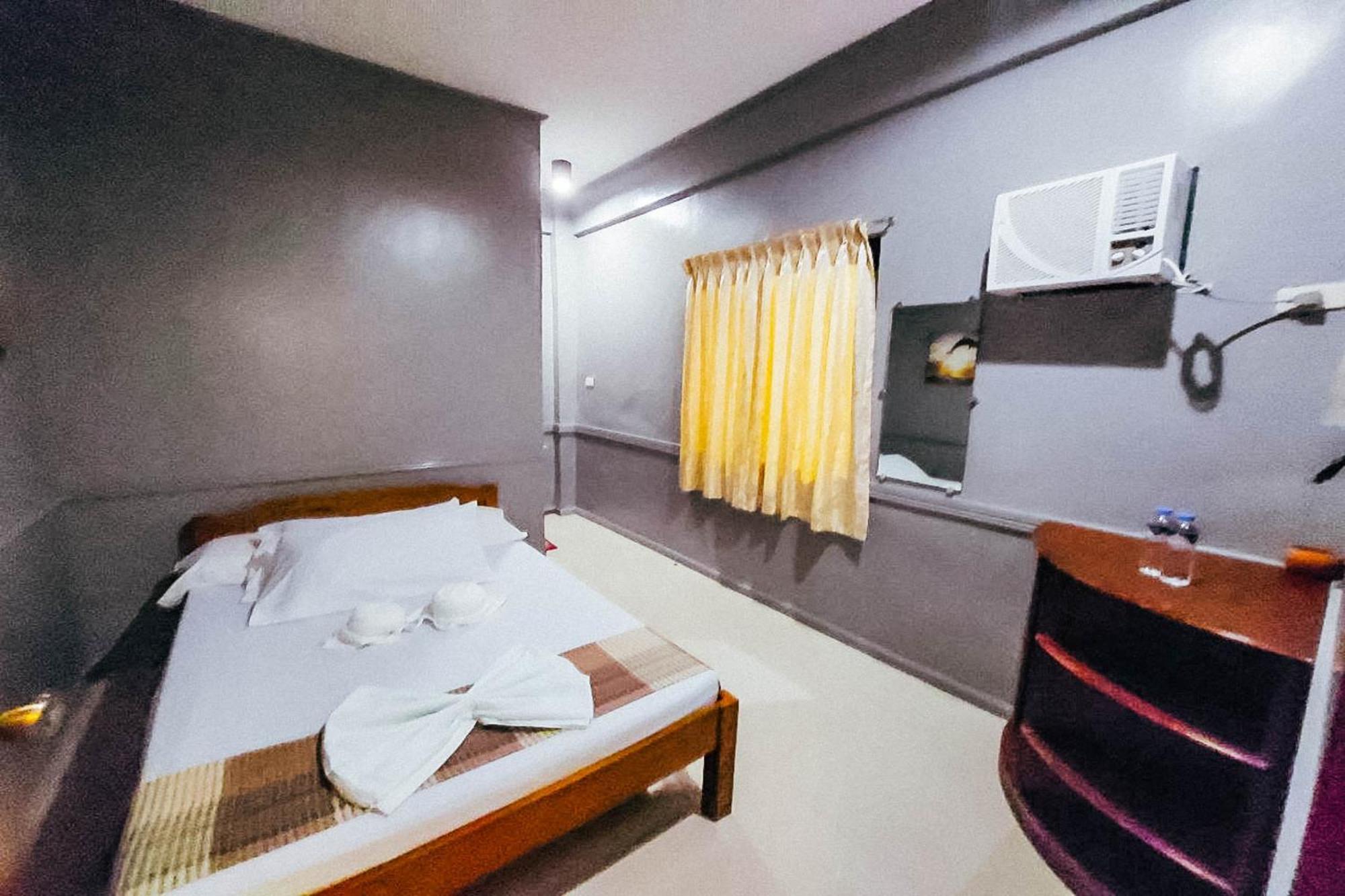 Mbg Travellers Inn Powered By Cocotel Puerto Princesa Camera foto