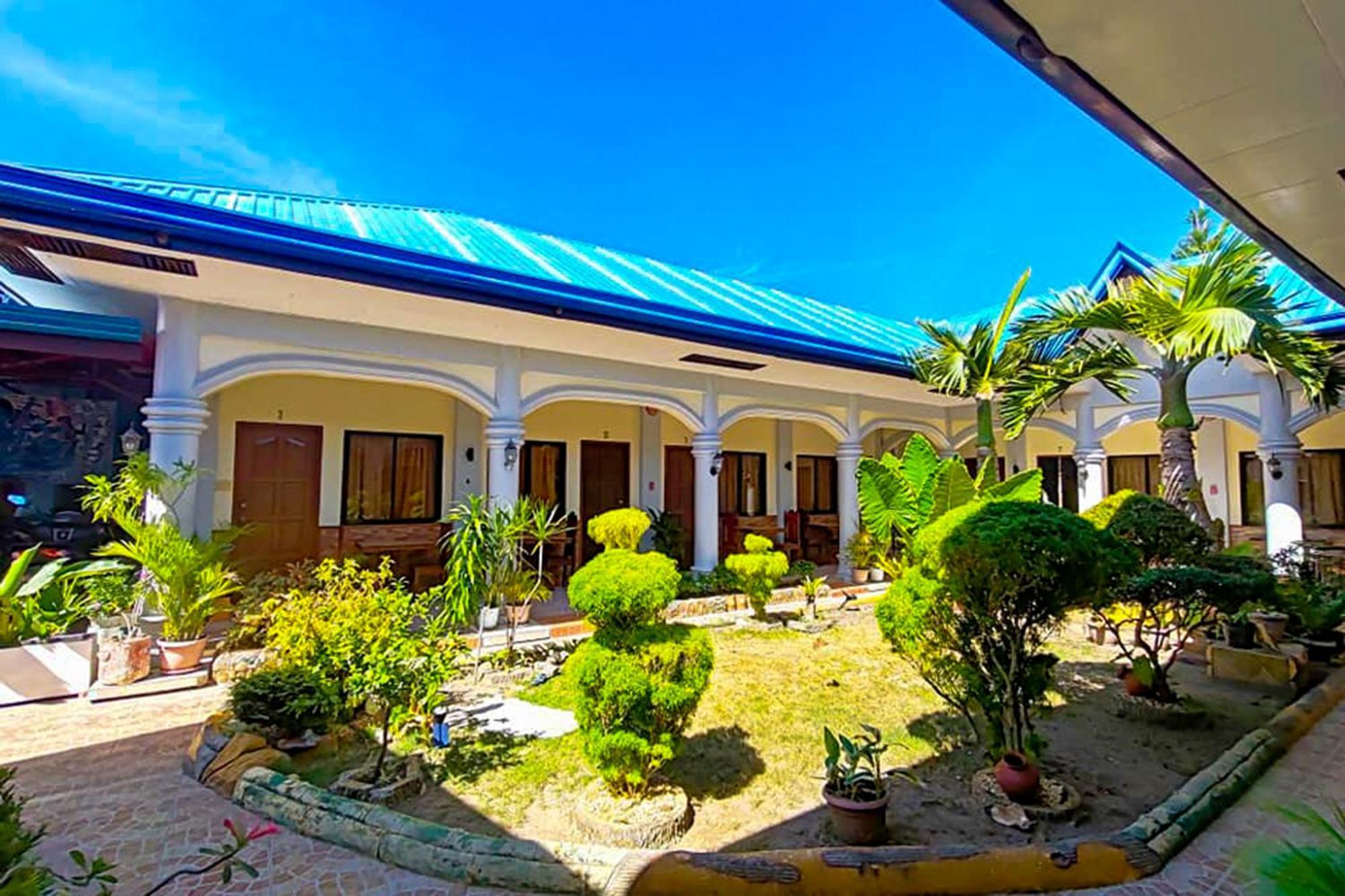 Mbg Travellers Inn Powered By Cocotel Puerto Princesa Esterno foto